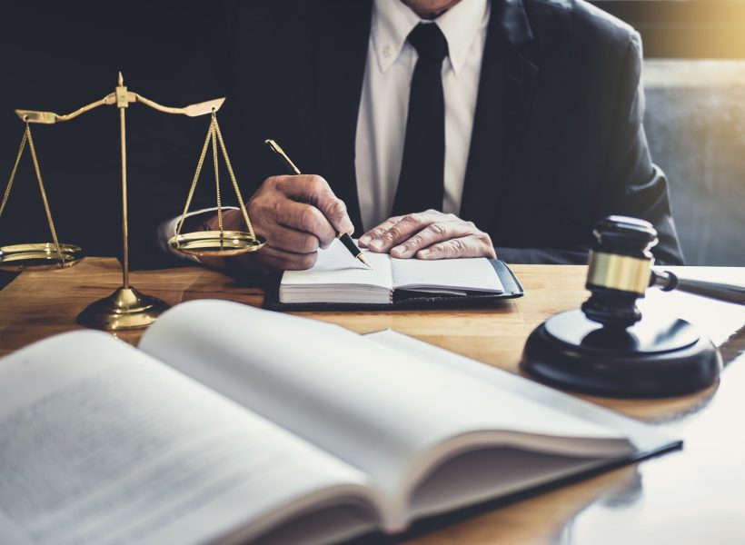 male-lawyer-or-judge-working-with-contract-papers.jpg male-lawyer-or-judge-working-with-contract-papers.jpg